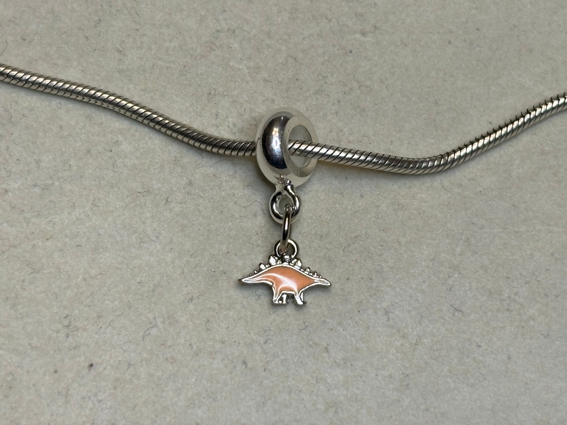 Orange Stegosaurus Charm – Arose Jeweley’s